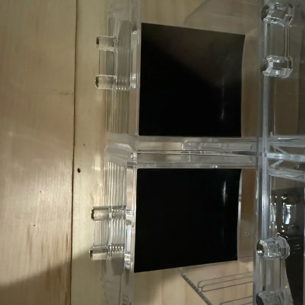Sleek Acrylic Makeup Organizer with Black Detailing